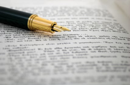 CFO FACTORY training IMA accredited Egypt Middle East – Image of a fountain pen on a financial document symbolizing professional financial education – Become a transformative leader in finance